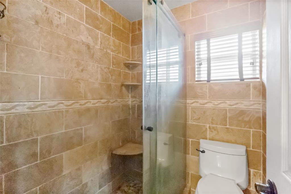 12626 Southwest 9th Place Davie, FL 33325 - Photo 11 of 26 a bathroom with a toilet and a shower