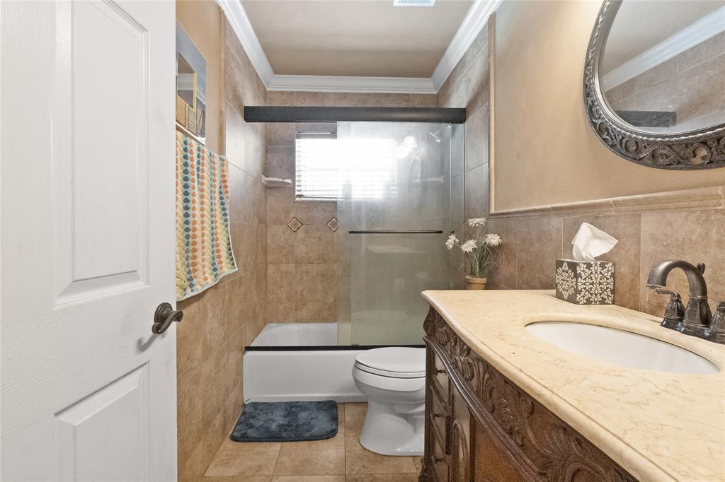 12626 Southwest 9th Place Davie, FL 33325 - Photo 14 of 26 a bathroom with a sink a toilet and a mirror