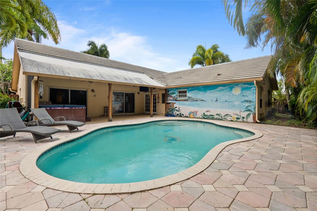 12626 Southwest 9th Place Davie, FL 33325 - Photo 18 of 26 a view of a swimming pool with a patio