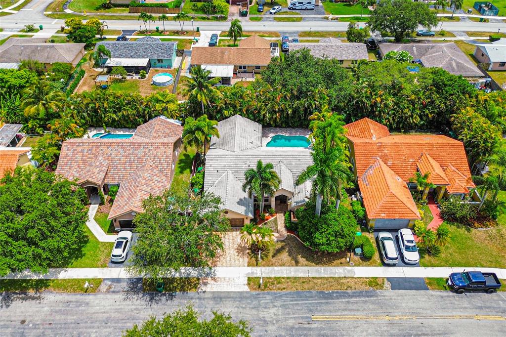 12626 Southwest 9th Place Davie, FL 33325 - Photo 21 of 26 an aerial view of a house with a yard and lake view