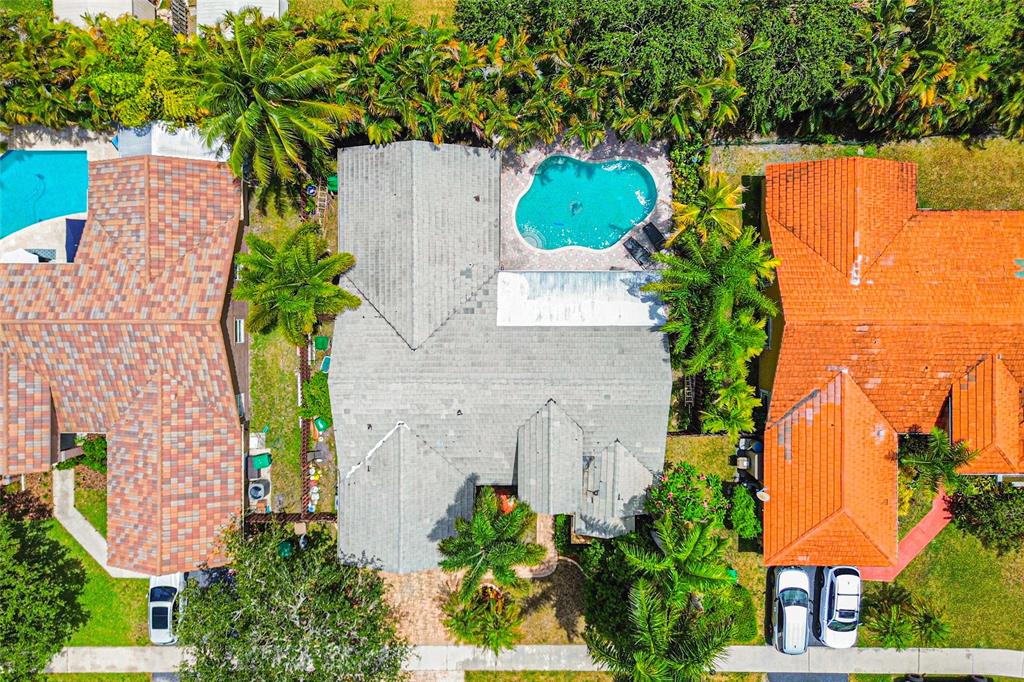 12626 Southwest 9th Place Davie, FL 33325 - Photo 22 of 26 an aerial view of a house with a yard and garden
