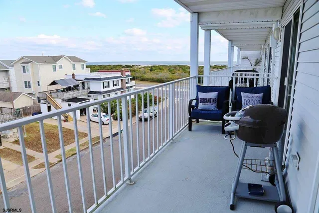 a view of balcony with furniture