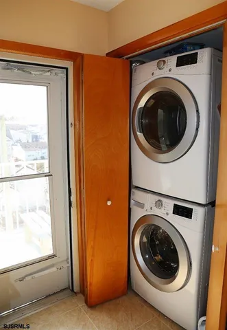 a view of a hallway with washer and dryer