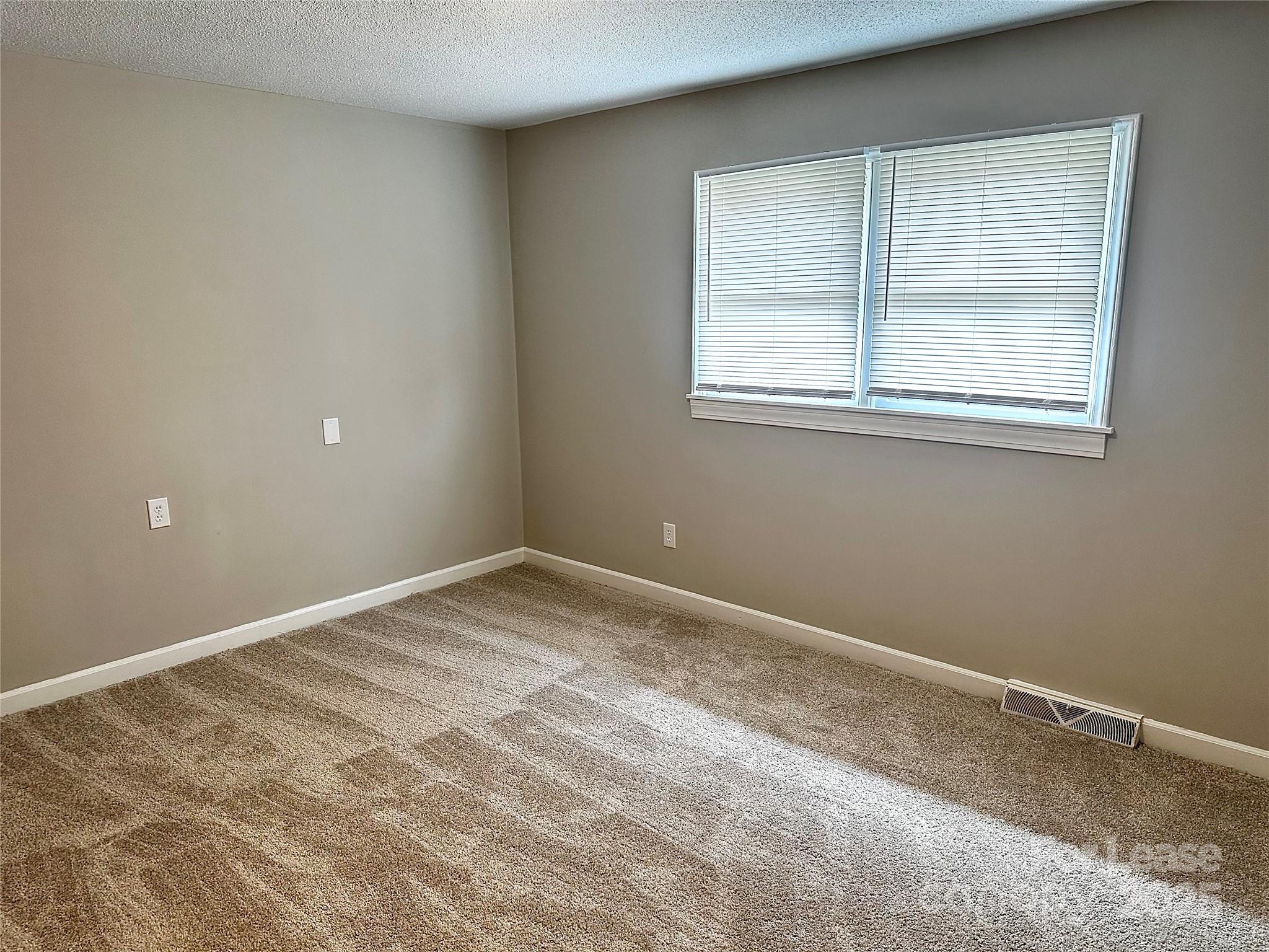 916 West 5th Avenue, Unit C Lexington, NC 27292 - Photo 15 of 24 a view of empty room with window