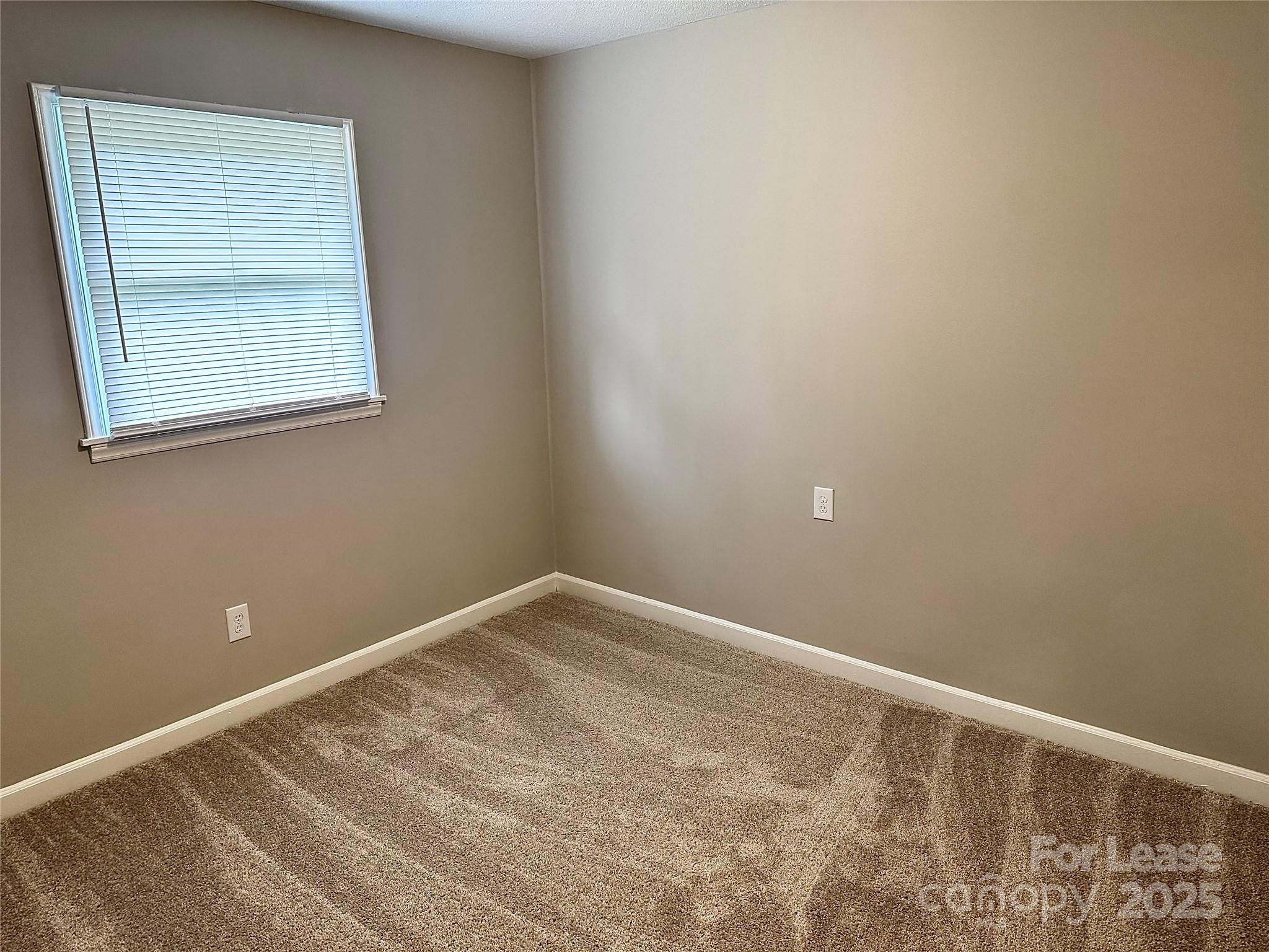 916 West 5th Avenue, Unit C Lexington, NC 27292 - Photo 22 of 24 a view of an empty room with a window