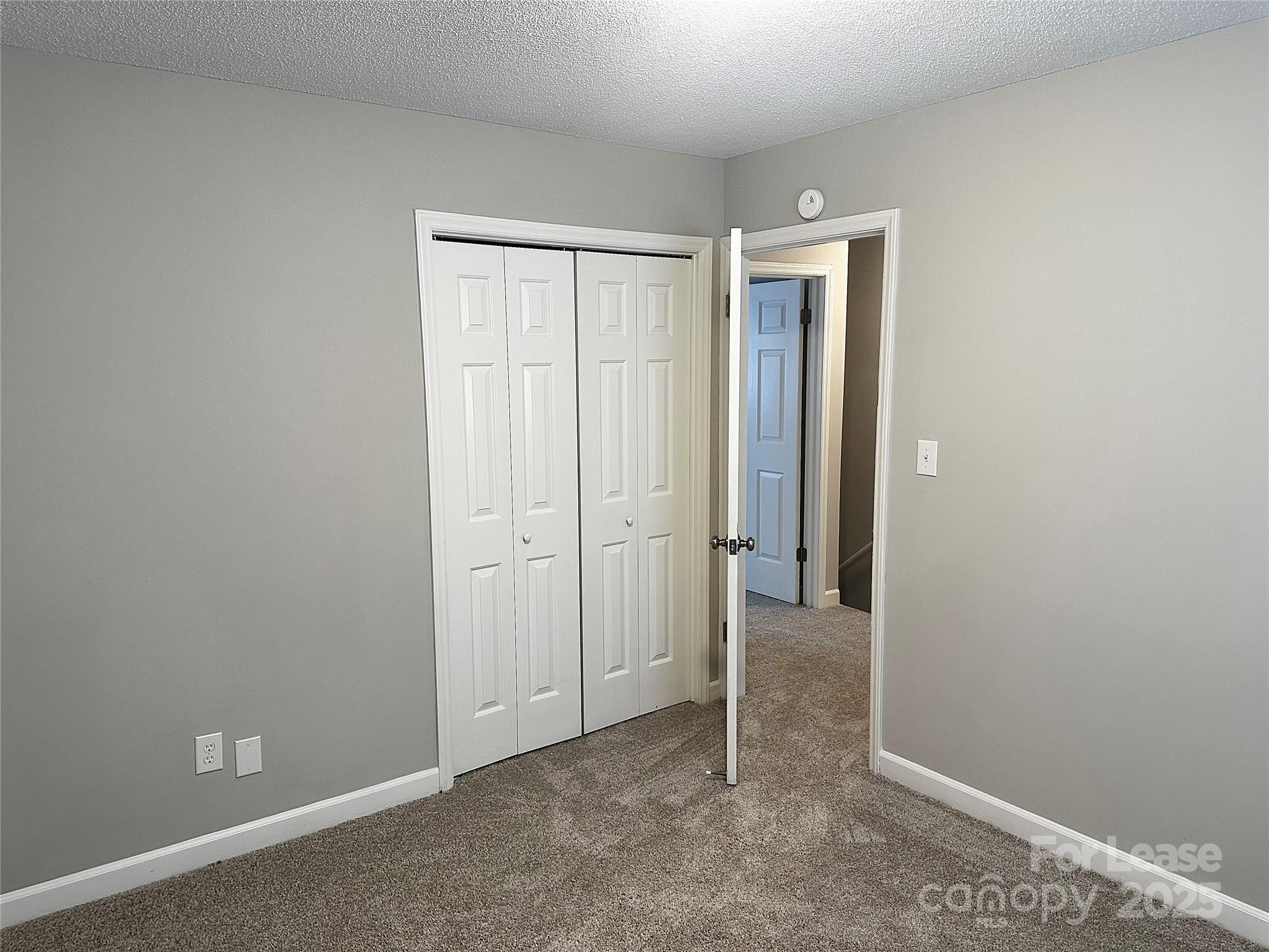 916 West 5th Avenue, Unit C Lexington, NC 27292 - Photo 23 of 24 an empty room with closet