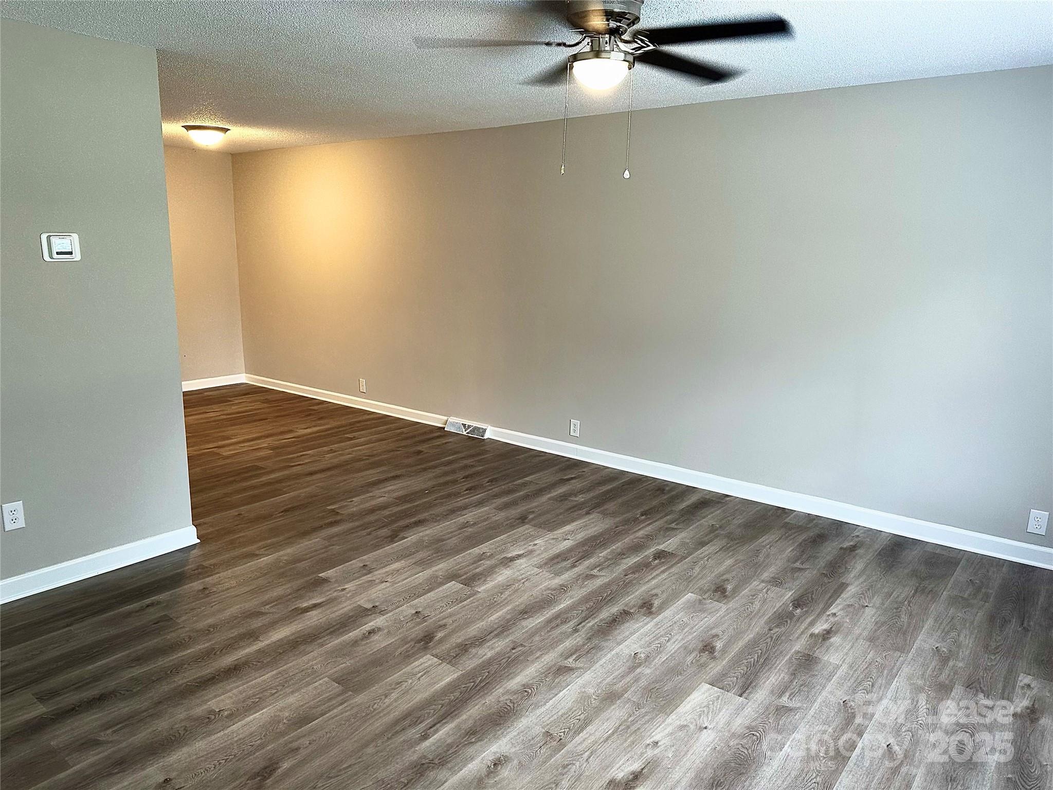 916 West 5th Avenue, Unit C Lexington, NC 27292 - Photo 4 of 24 wooden floor in an empty room