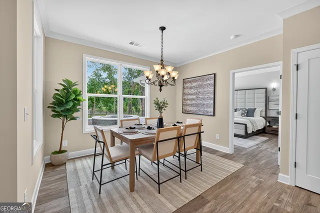 a view of a dining room with furniture window and outside view