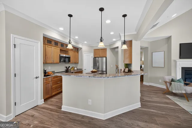a kitchen with a sink stove and refrigerator