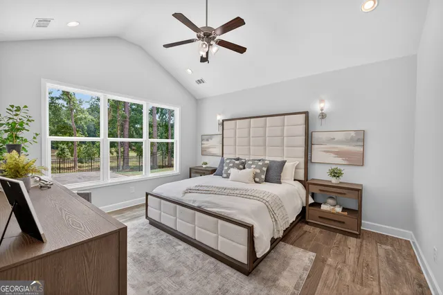 a bedroom with a bed and a balcony