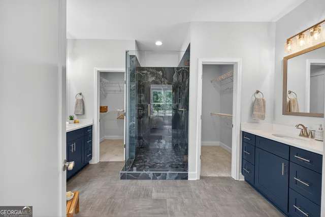 a living room with stainless steel appliances kitchen island granite countertop furniture and a shower