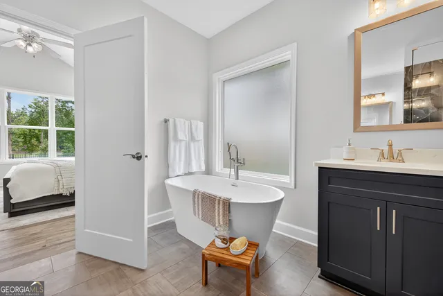 a bed room with a bed and a window