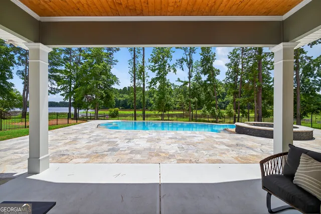 a patio with patio couch and outdoor seating