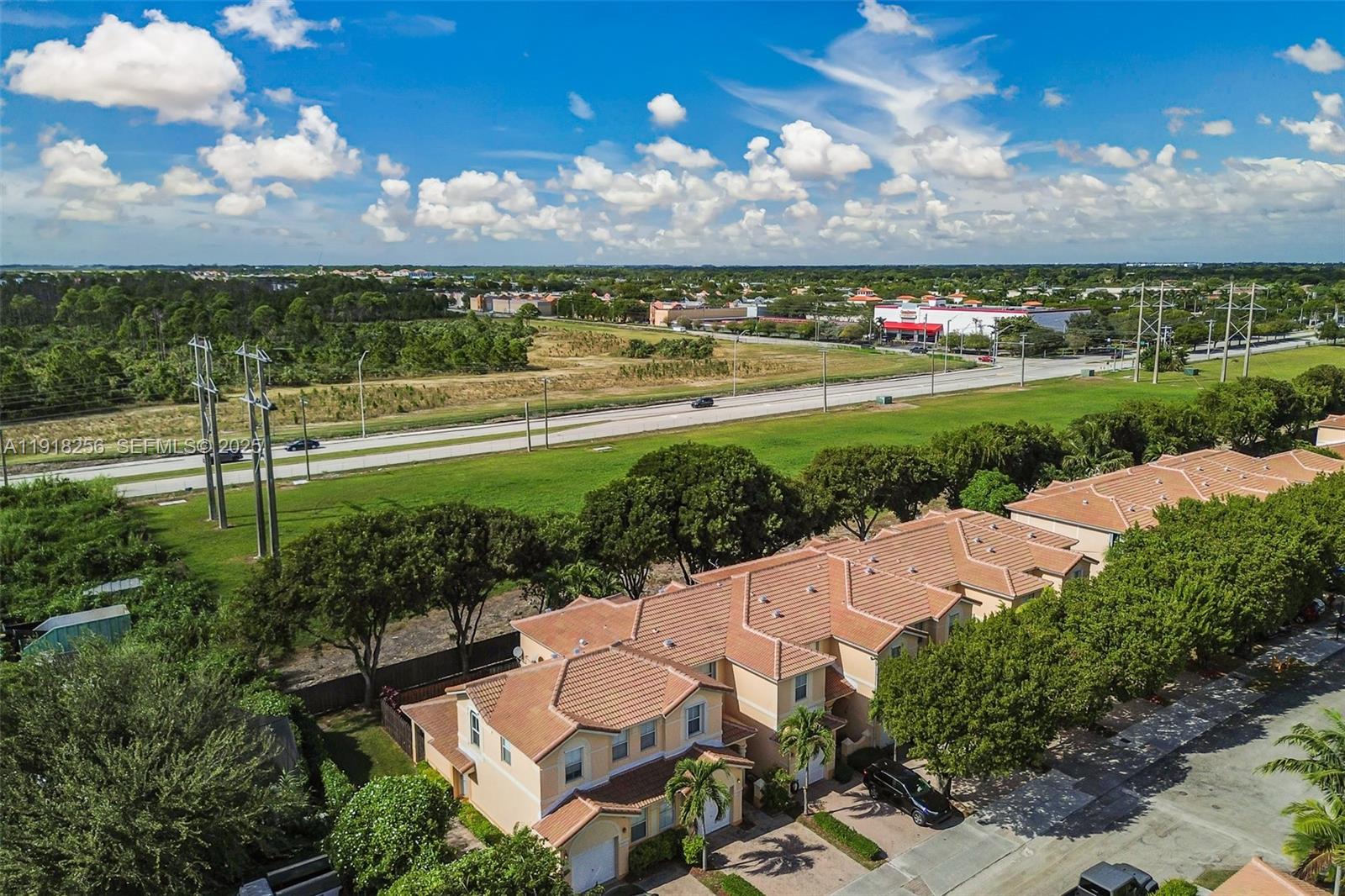 12566 Southwest 126th Avenue Miami, FL 33186 - Photo 13 of 59 a view of a city with lots of residential buildings ocean and mountain view in back
