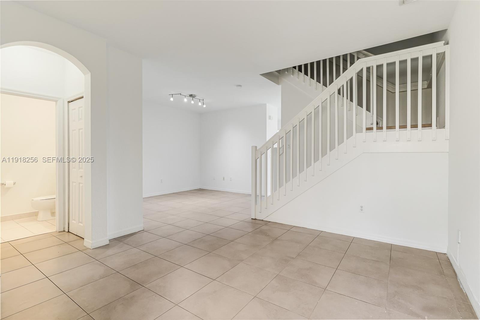 12566 Southwest 126th Avenue Miami, FL 33186 - Photo 19 of 59 a view of a hallway with staircase
