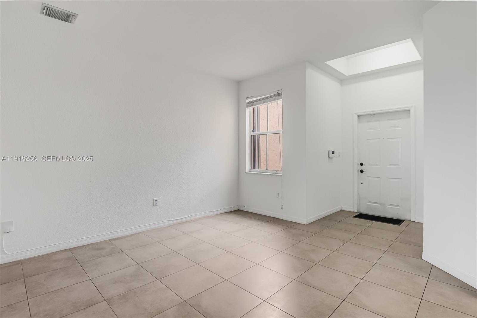 12566 Southwest 126th Avenue Miami, FL 33186 - Photo 21 of 59 an empty room with windows