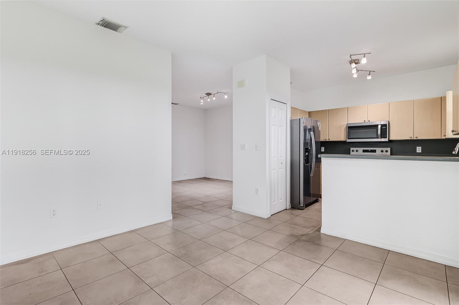 12566 Southwest 126th Avenue Miami, FL 33186 - Photo 27 of 59 a view of a kitchen with electric appliances
