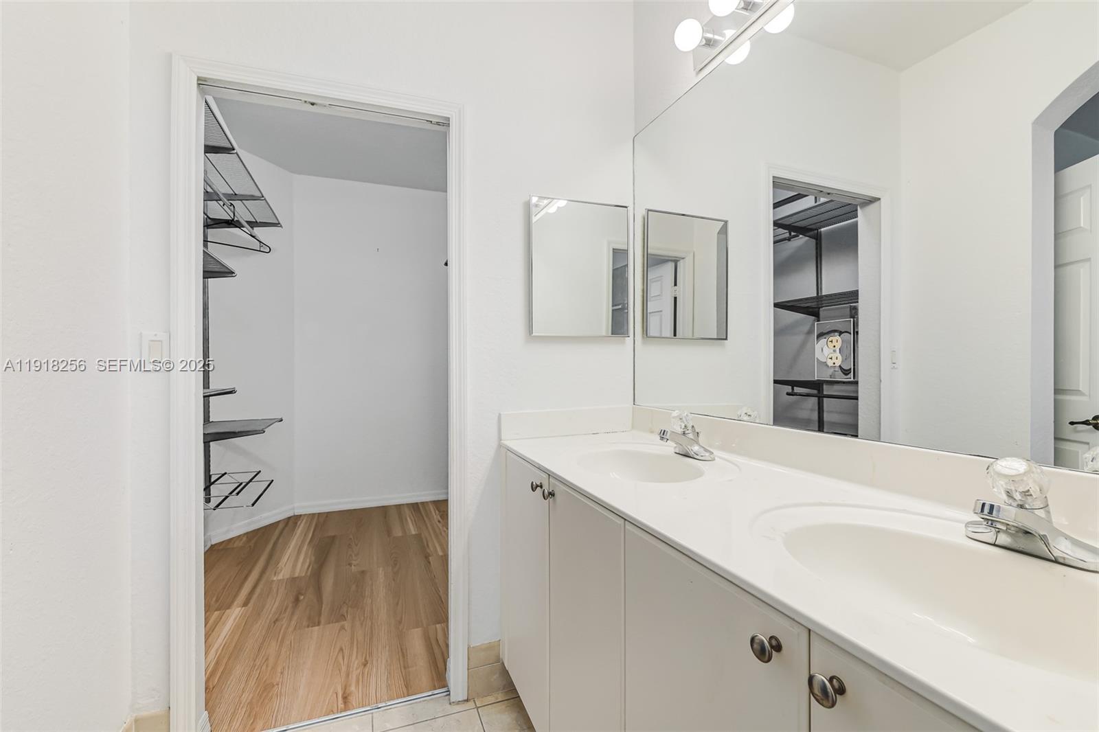 12566 Southwest 126th Avenue Miami, FL 33186 - Photo 38 of 59 a bathroom with a sink and a mirror