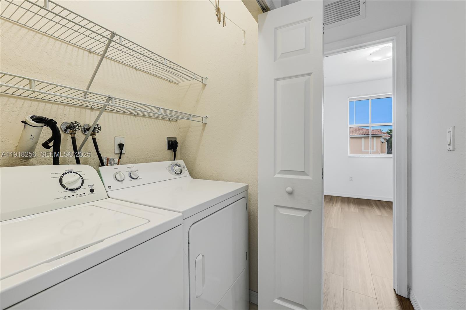 12566 Southwest 126th Avenue Miami, FL 33186 - Photo 43 of 59 a utility room with dryer and washer