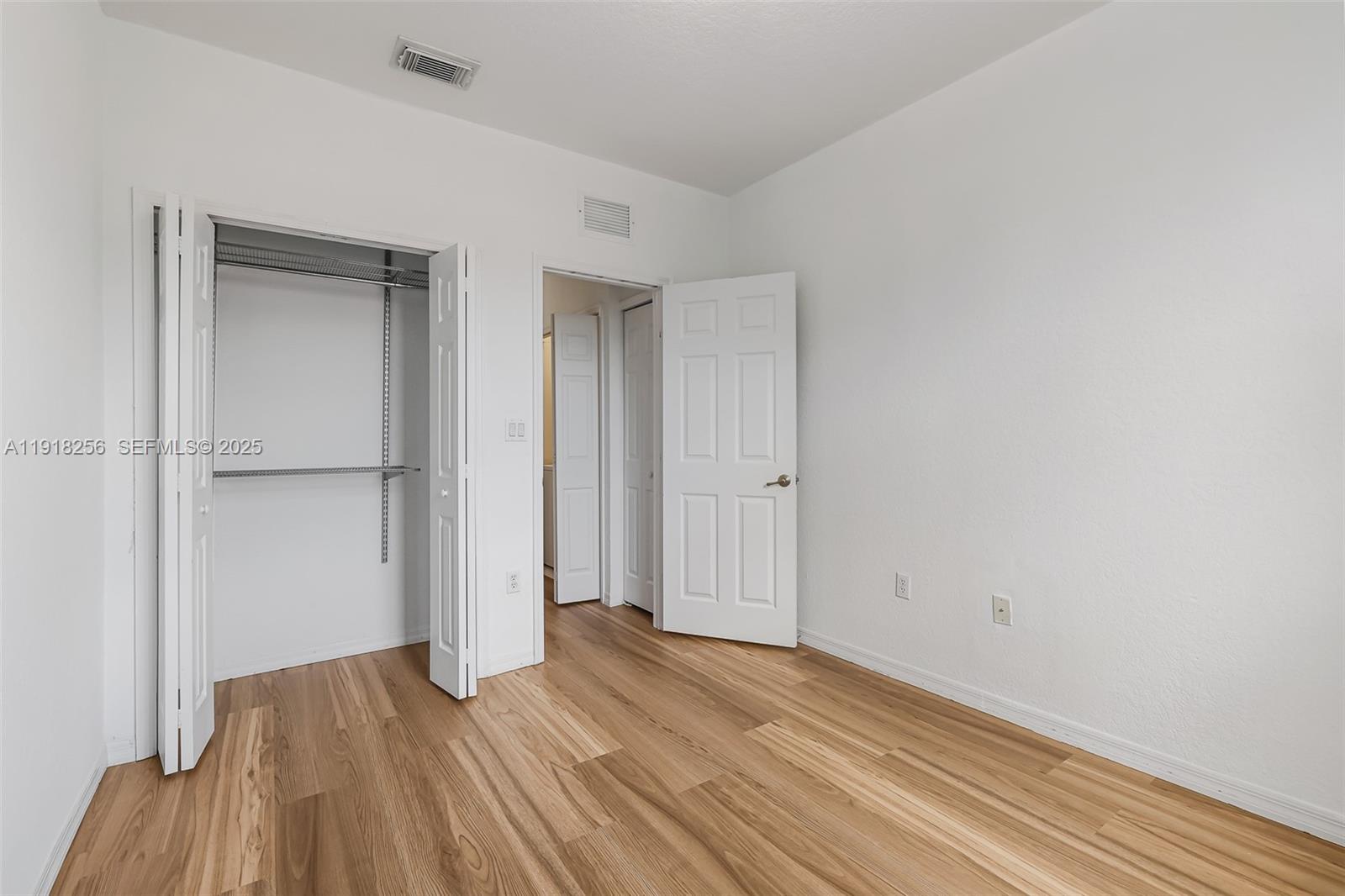 12566 Southwest 126th Avenue Miami, FL 33186 - Photo 45 of 59 a view of empty room with wooden floor