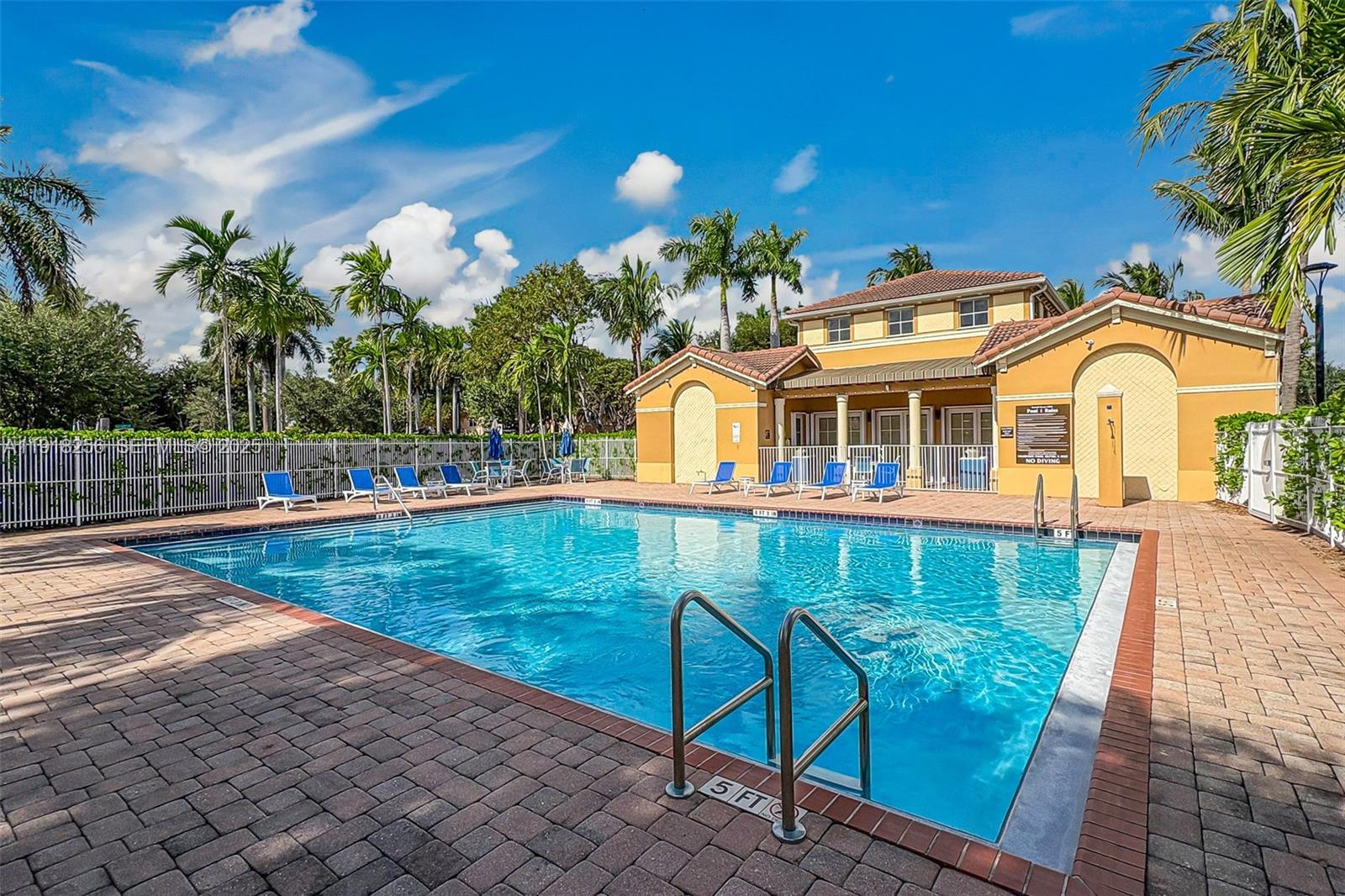 12566 Southwest 126th Avenue Miami, FL 33186 - Photo 58 of 59 a front view of a house with a garden