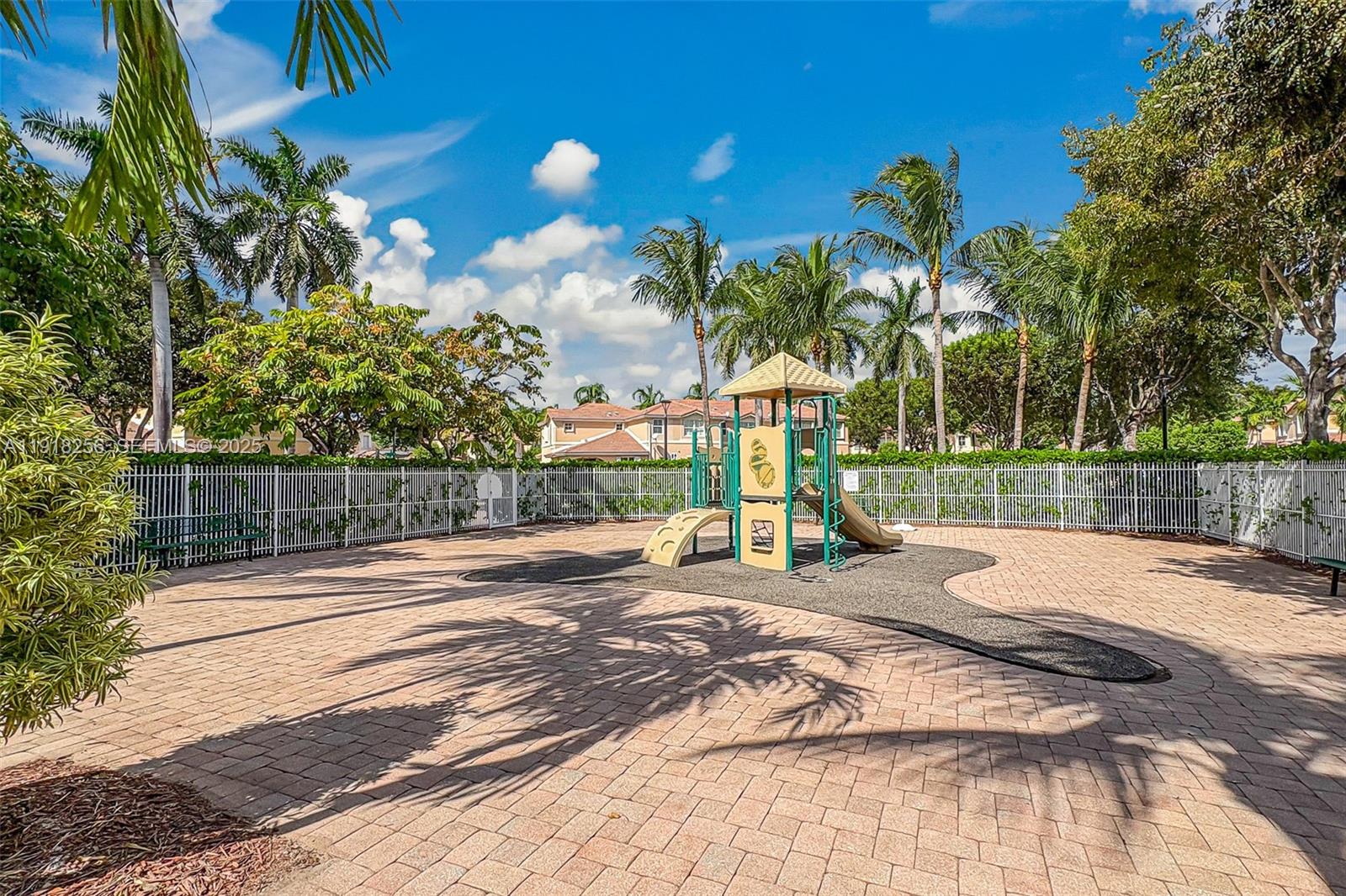 12566 Southwest 126th Avenue Miami, FL 33186 - Photo 9 of 59 a view of a park with swings and slides