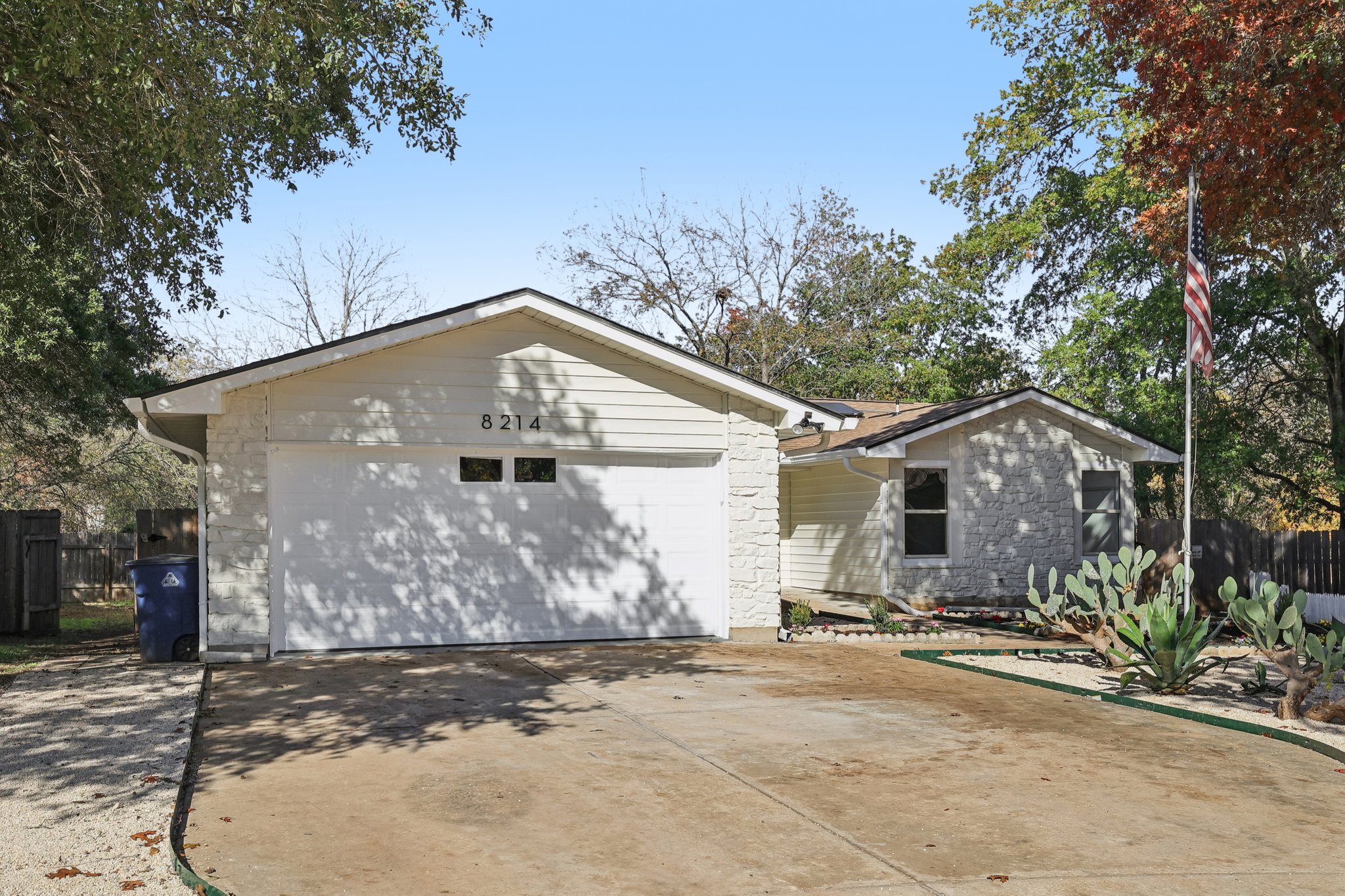 8214 Kearsarge Drive Austin, TX 78745 - Photo 2 of 40 Garage with concrete driveway