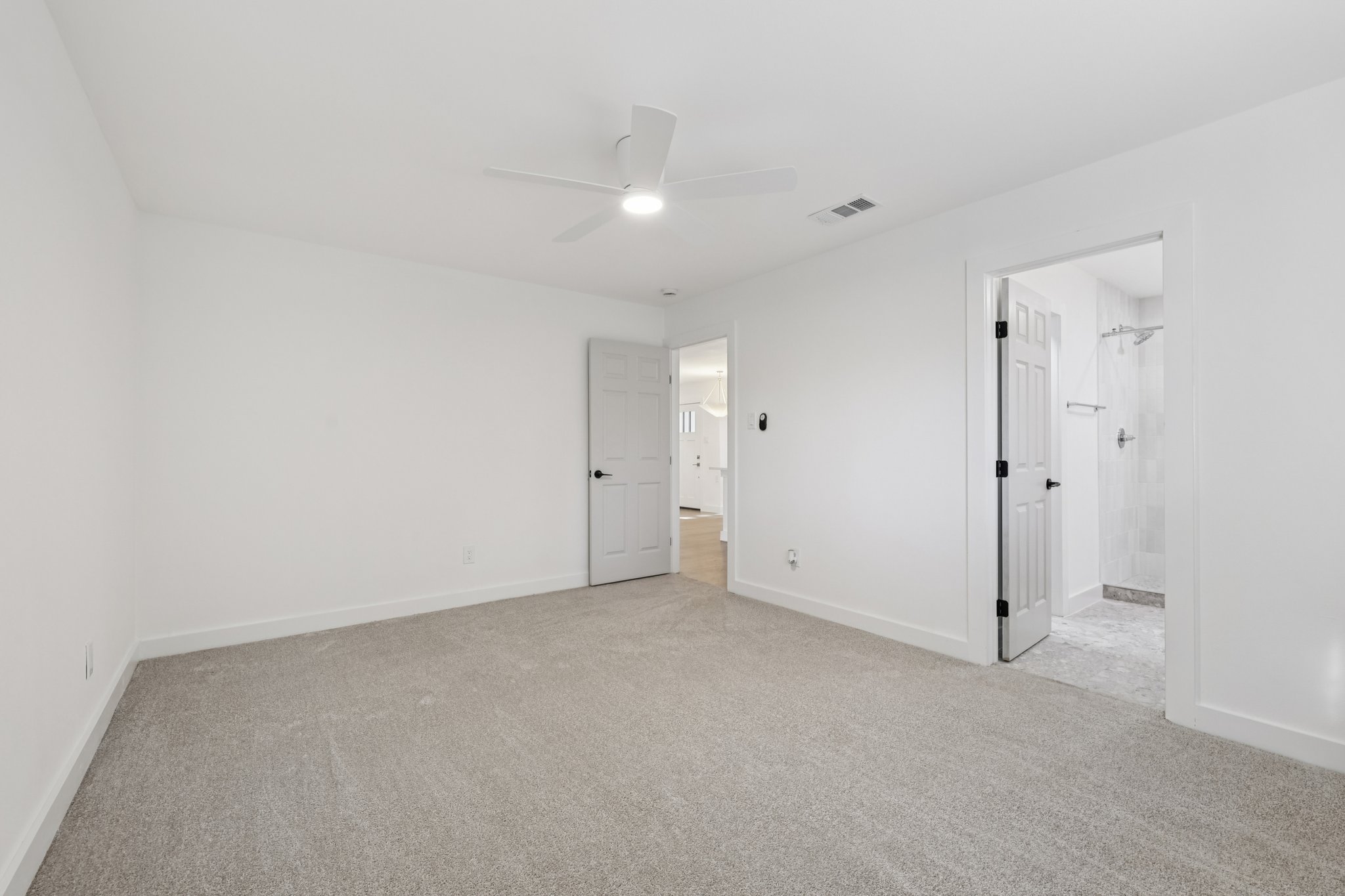 8214 Kearsarge Drive Austin, TX 78745 - Photo 21 of 40 Unfurnished bedroom featuring light colored carpet and a ceiling fan