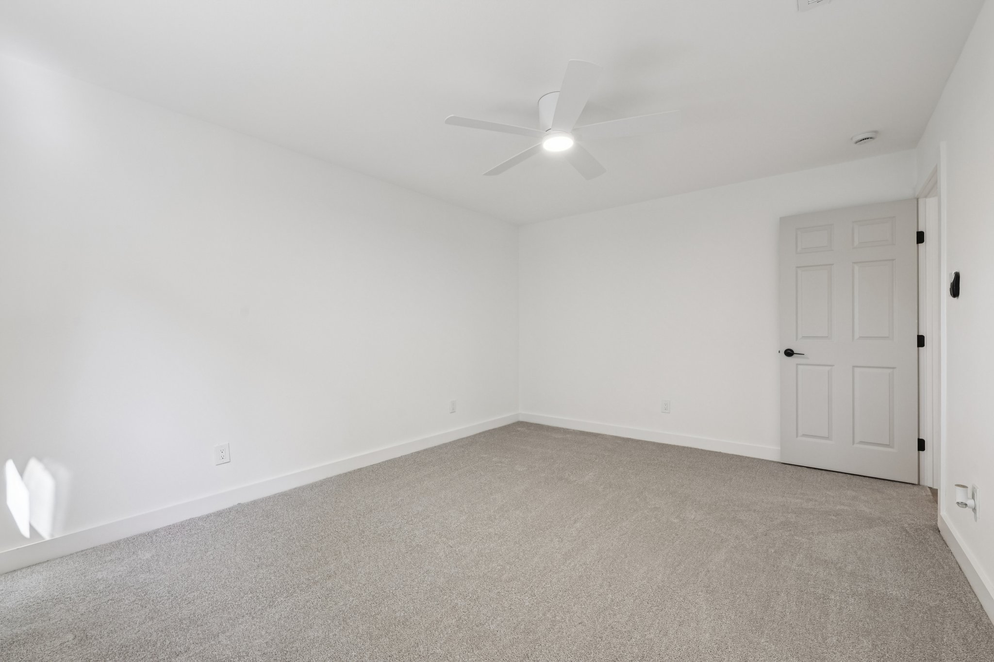 8214 Kearsarge Drive Austin, TX 78745 - Photo 22 of 40 Unfurnished room with light carpet and ceiling fan