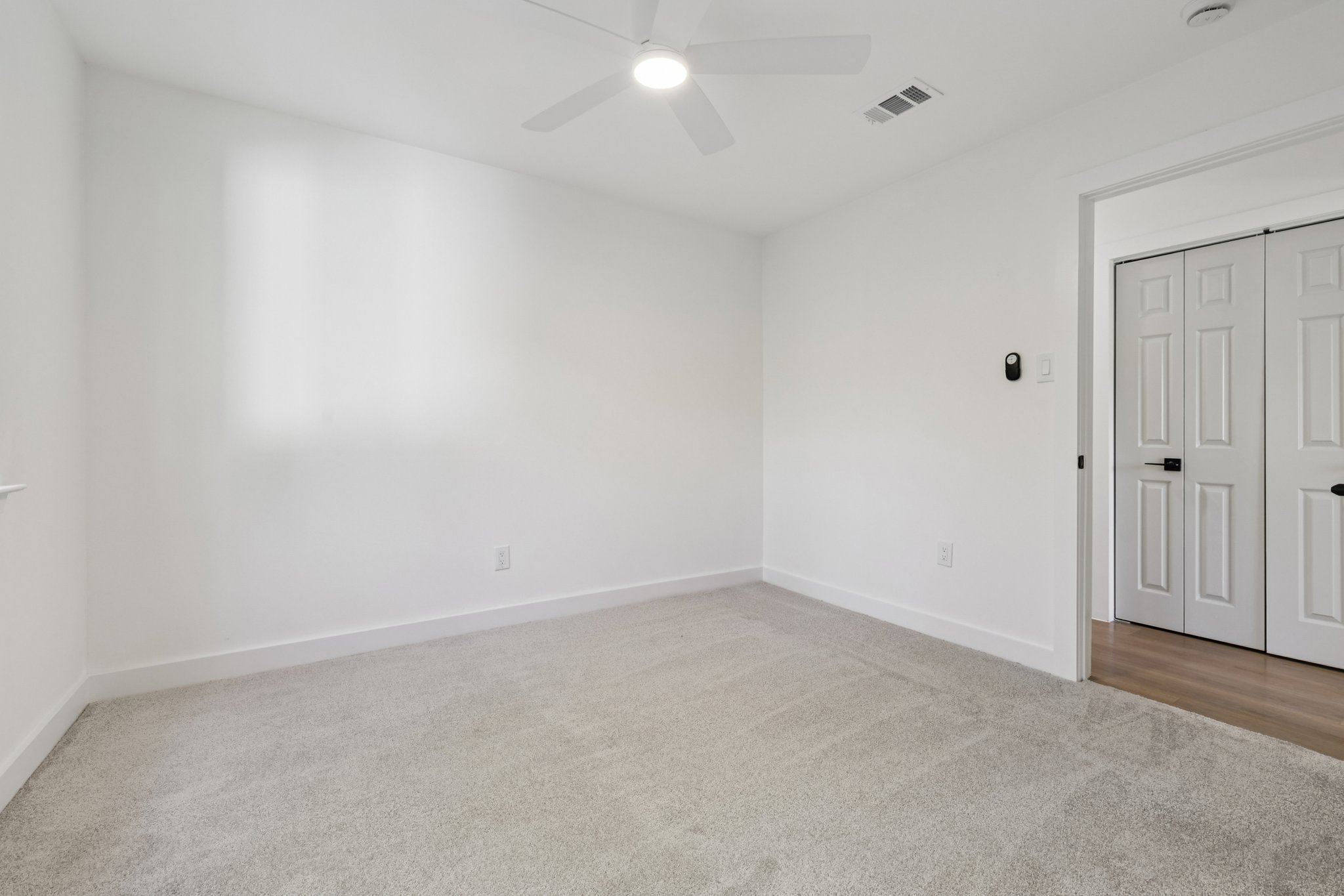 8214 Kearsarge Drive Austin, TX 78745 - Photo 27 of 40 Unfurnished bedroom with light carpet and ceiling fan