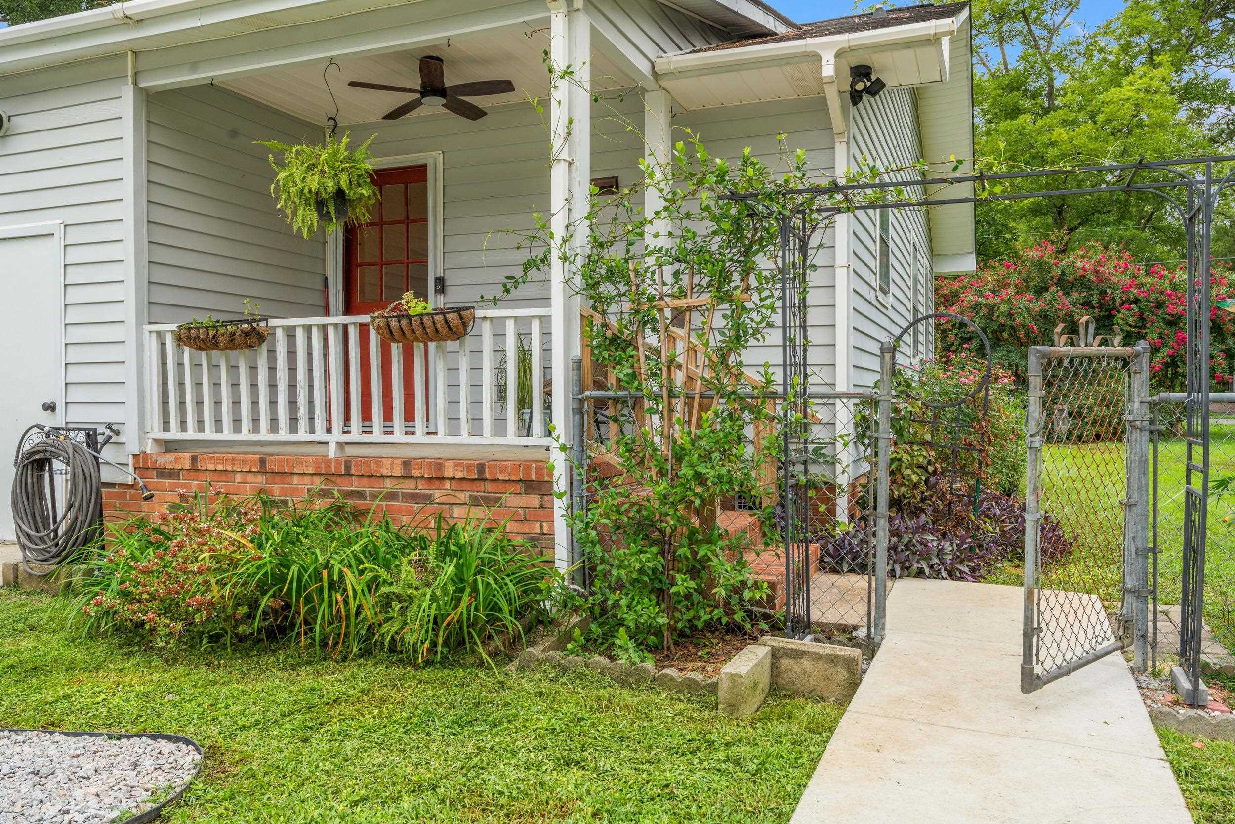 208 Bethea Street Latta, SC 29565 - Photo 22 of 36 Entrance to property featuring a gate, covered porch, and ceiling fan