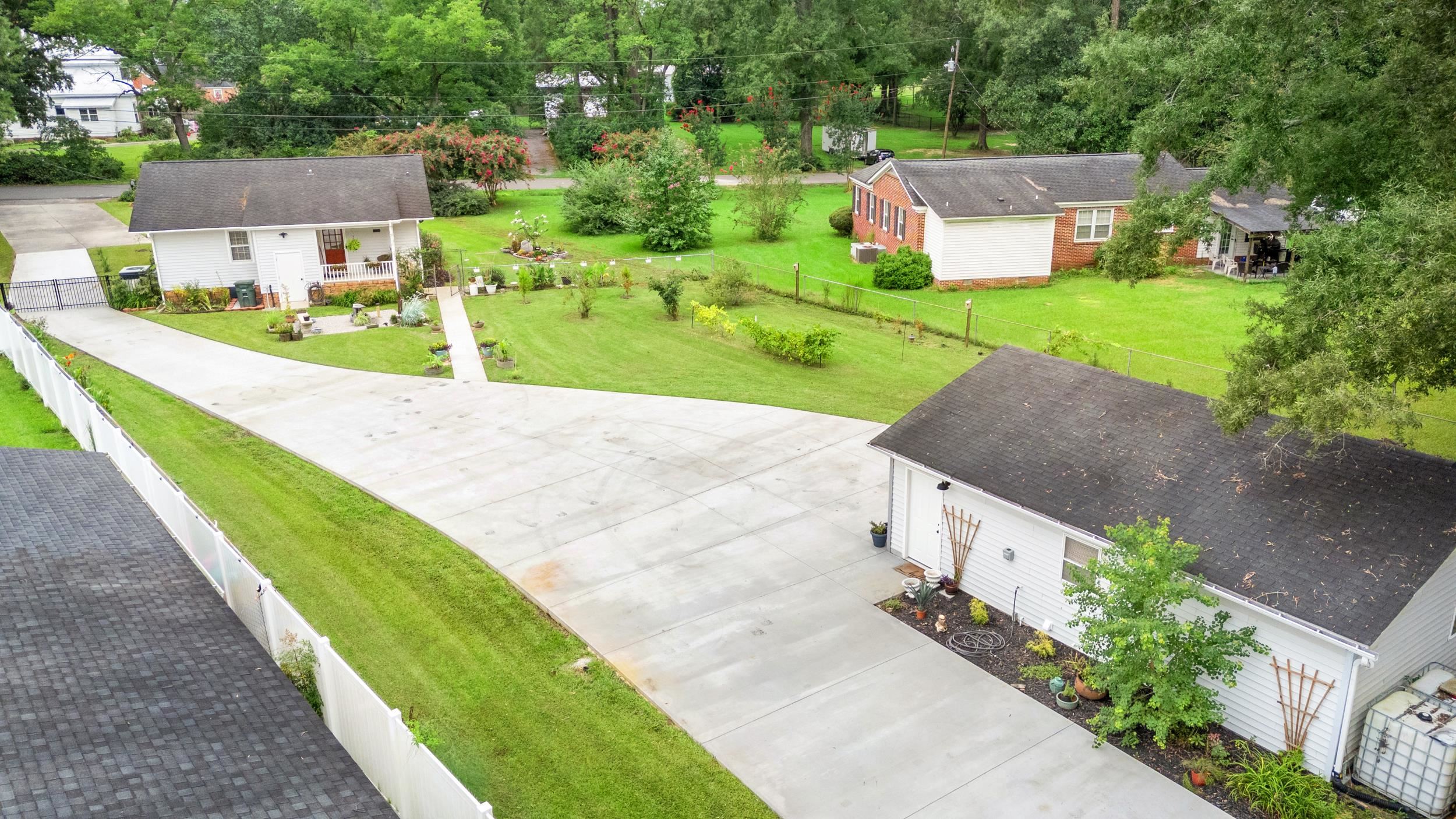208 Bethea Street Latta, SC 29565 - Photo 24 of 36 Aerial view of a tree filled landscape