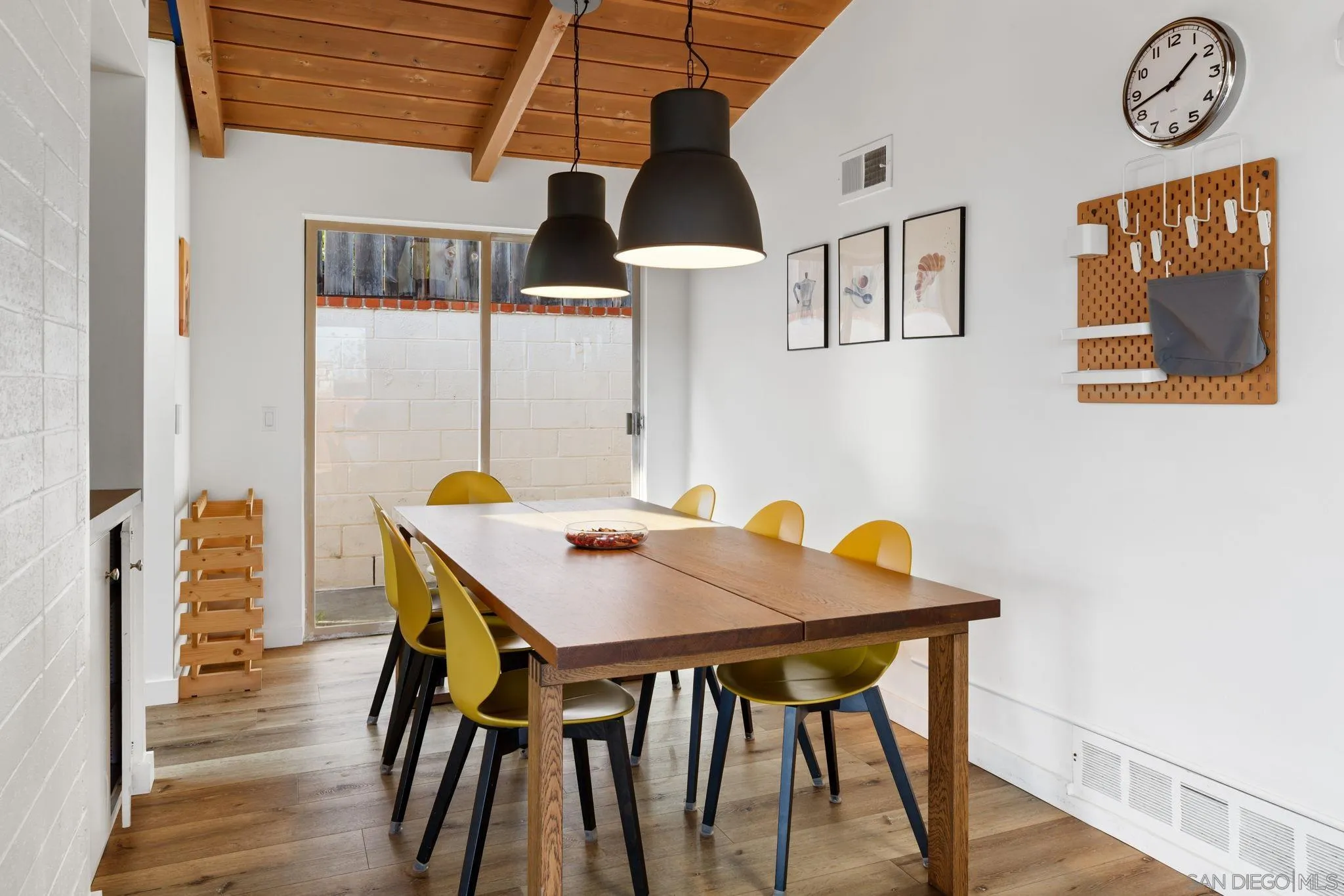 5643 Linda Rosa Avenue La Jolla, CA 92037 - Photo 14 of 56 a view of a dining room with furniture and wooden floor
