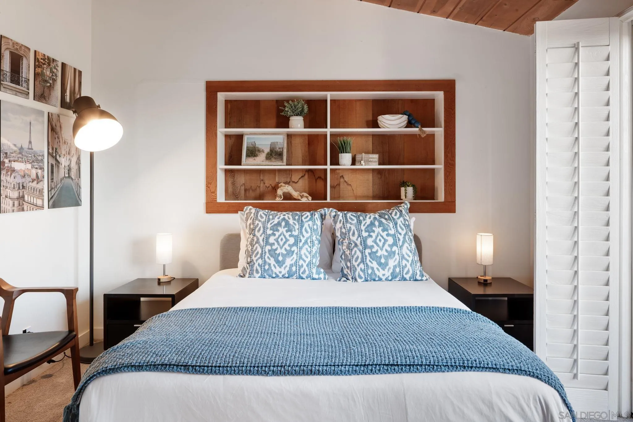5643 Linda Rosa Avenue La Jolla, CA 92037 - Photo 18 of 56 a bedroom with a large bed and a window