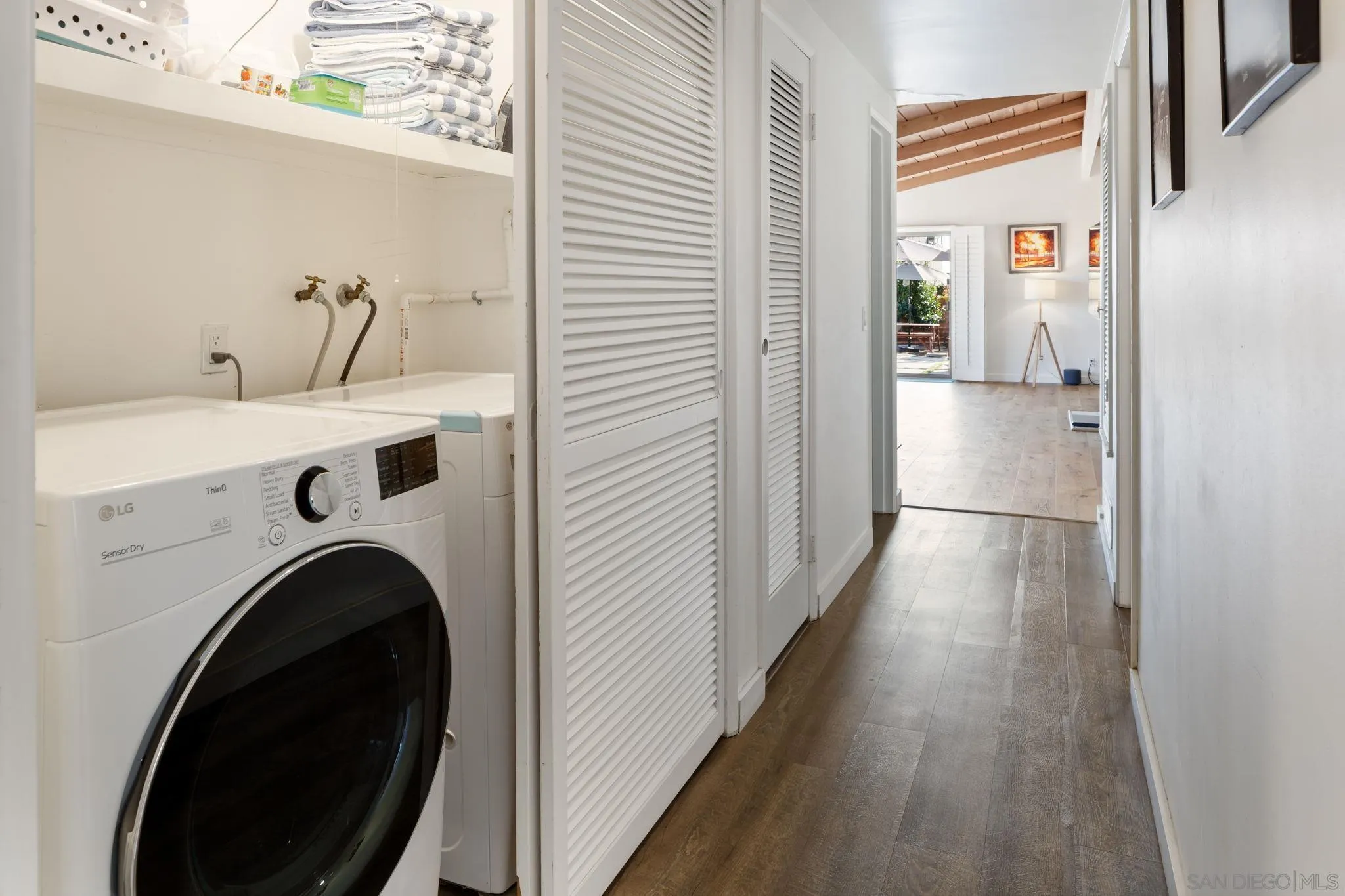 5643 Linda Rosa Avenue La Jolla, CA 92037 - Photo 21 of 56 a view of a hallway with washer and dryer