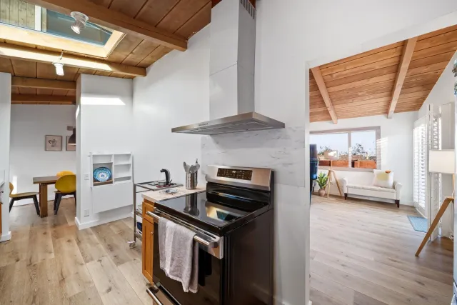 a bedroom with a bed chair and a window