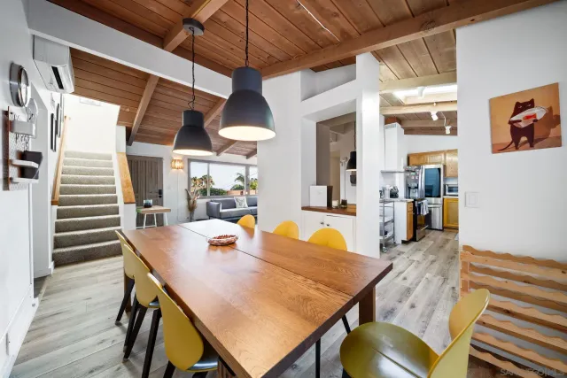 a bedroom with a bed lamp and a large window