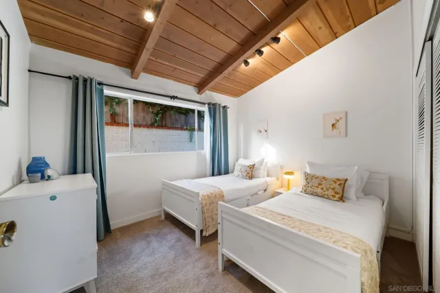 a view of a livingroom with furniture and a flat screen tv