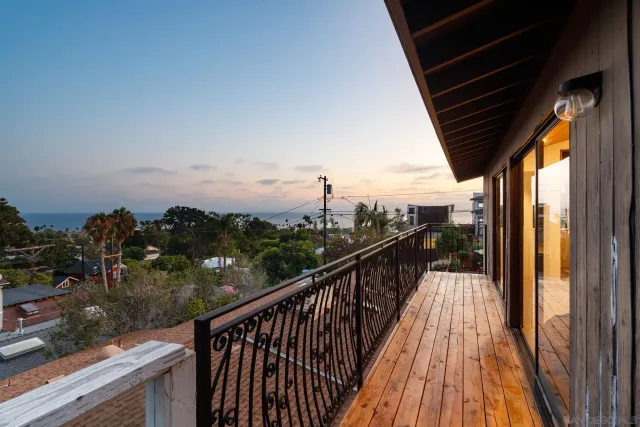 a view of a balcony with wooden floor