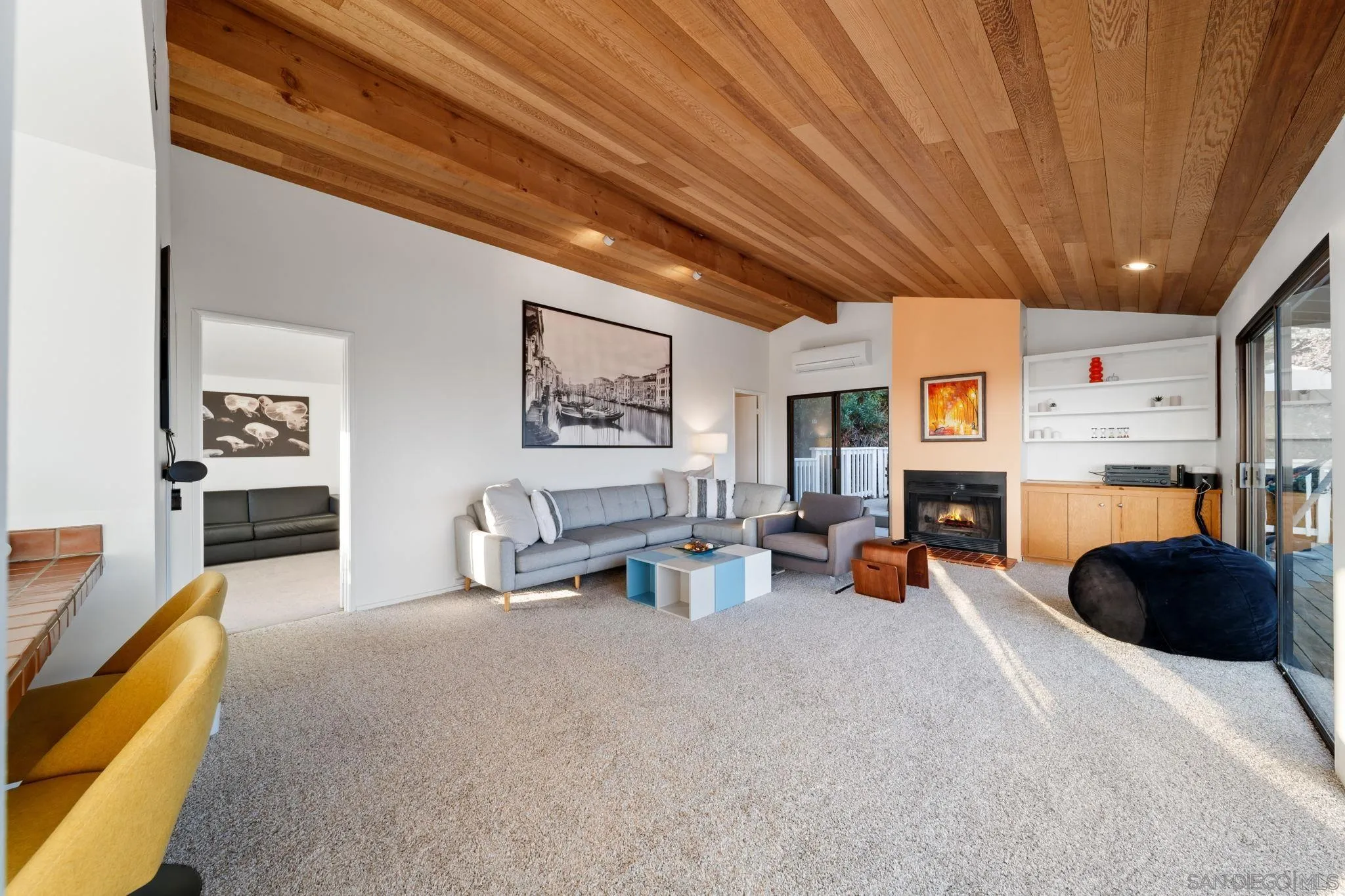 5643 Linda Rosa Avenue La Jolla, CA 92037 - Photo 42 of 56 a view of a livingroom with furniture and a flat screen tv