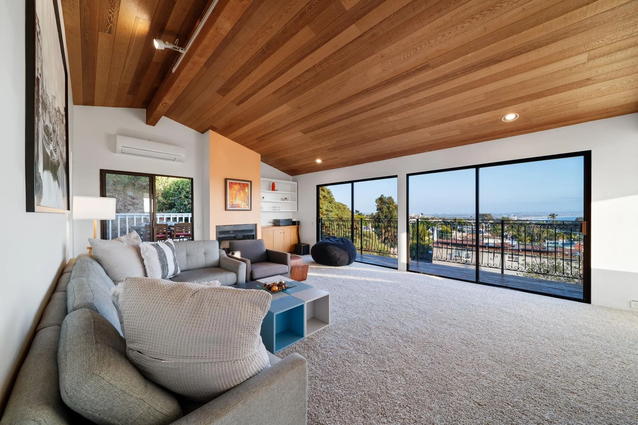 5643 Linda Rosa Avenue La Jolla, CA 92037 - Photo 44 of 56 a living room with furniture and a large window