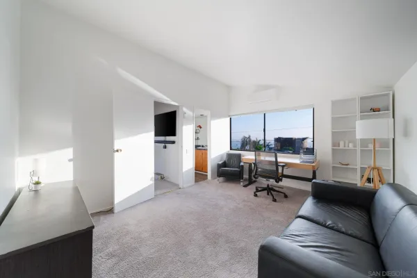 a bedroom with a bed and a cabinets