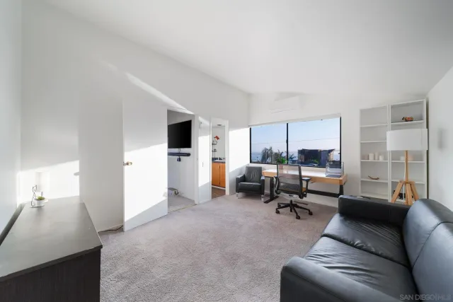 a bedroom with a bed and a cabinets