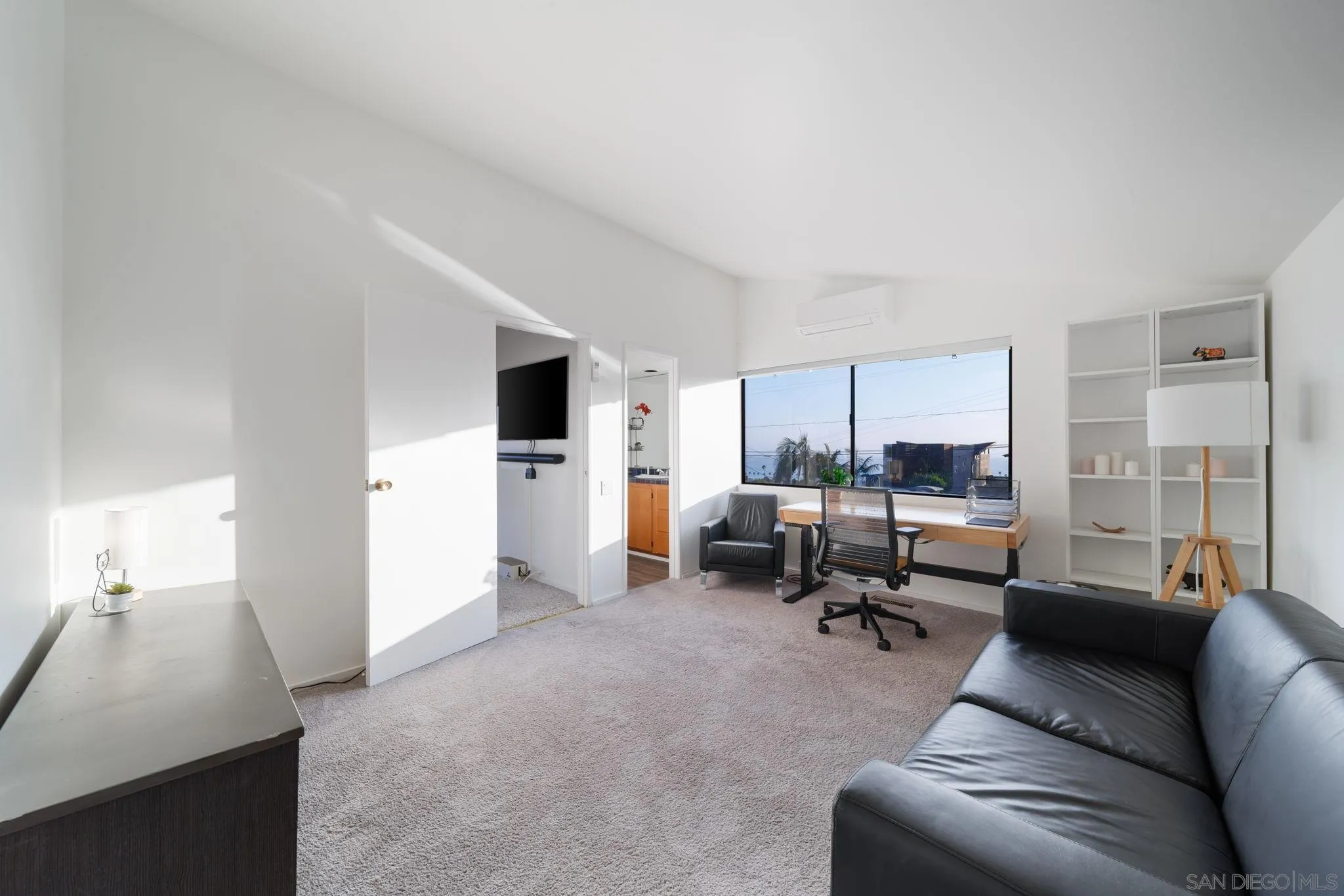 5643 Linda Rosa Avenue La Jolla, CA 92037 - Photo 45 of 56 a living room with furniture and a flat screen tv