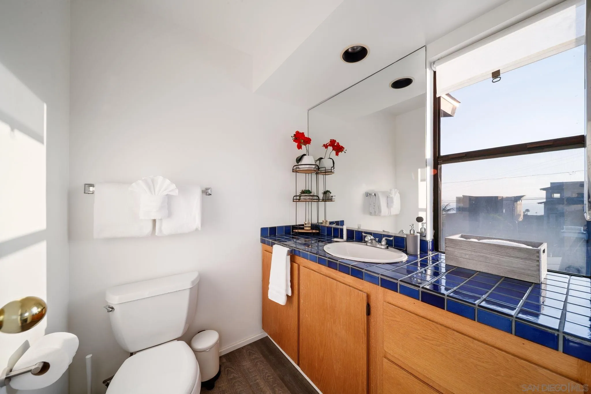 5643 Linda Rosa Avenue La Jolla, CA 92037 - Photo 46 of 56 a bathroom with a sink and a mirror