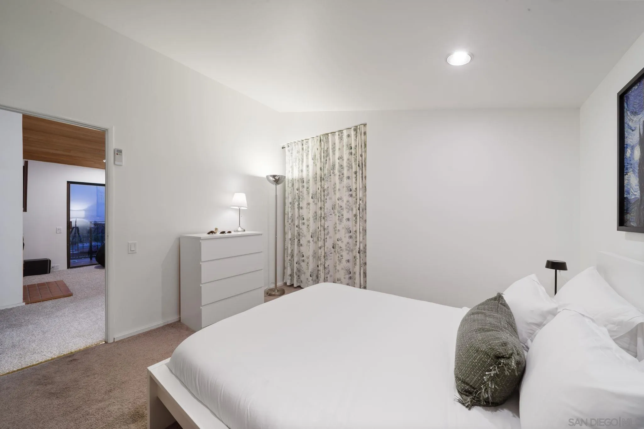 5643 Linda Rosa Avenue La Jolla, CA 92037 - Photo 49 of 56 a bedroom with a bed and a cabinets