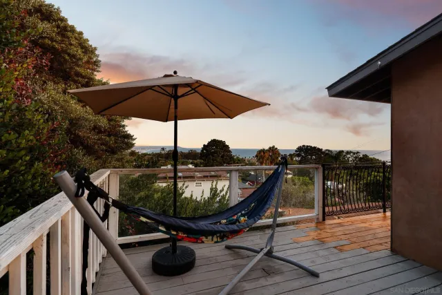 a view of roof deck with furniture