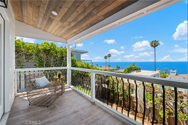 a view of a balcony with furniture