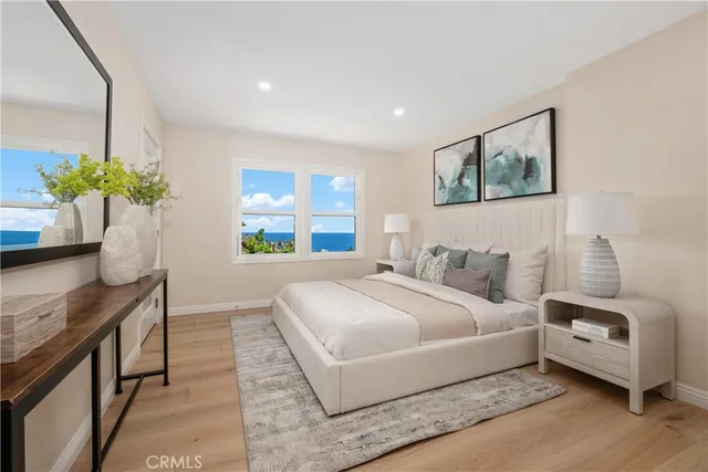 a bedroom with a bed table and a couch