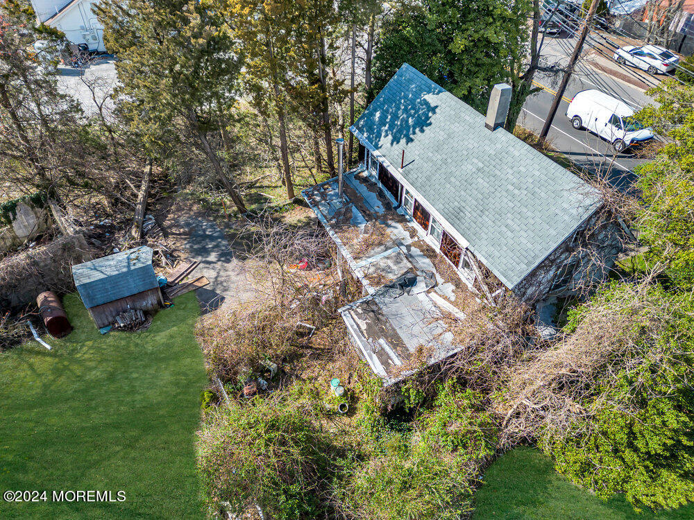 327 Mantoloking Road Brick, NJ 08723 - Photo 4 of 16 an aerial view of a house with a yard basket ball court and outdoor seating